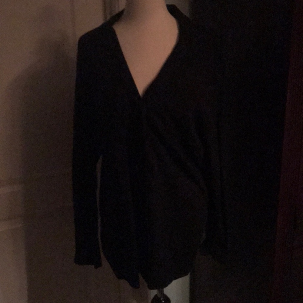 A women’s black suit coat.